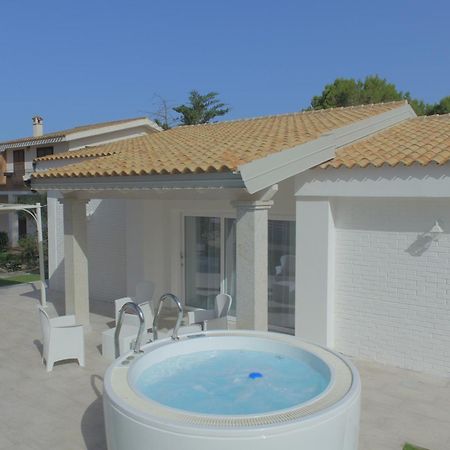 Ikebana Villas Porto Pino Beach Esterno foto